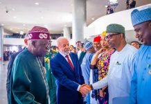 President Luiz Inacio Lula da Silva in a warm handshake with Dr. Iziaq Adekunle Salako Honourable Minister of State for Health & Social Welfare.