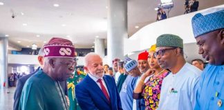 President Luiz Inacio Lula da Silva in a warm handshake with Dr. Iziaq Adekunle Salako Honourable Minister of State for Health & Social Welfare.