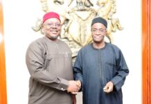The PS FMSDIGA, Dr. Onwusoro Maduka Ihemelandu in a hand shake with the Director General Budget Office of the Federation Mr Tanimu Yukubu