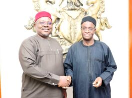 The PS FMSDIGA, Dr. Onwusoro Maduka Ihemelandu in a hand shake with the Director General Budget Office of the Federation Mr Tanimu Yukubu