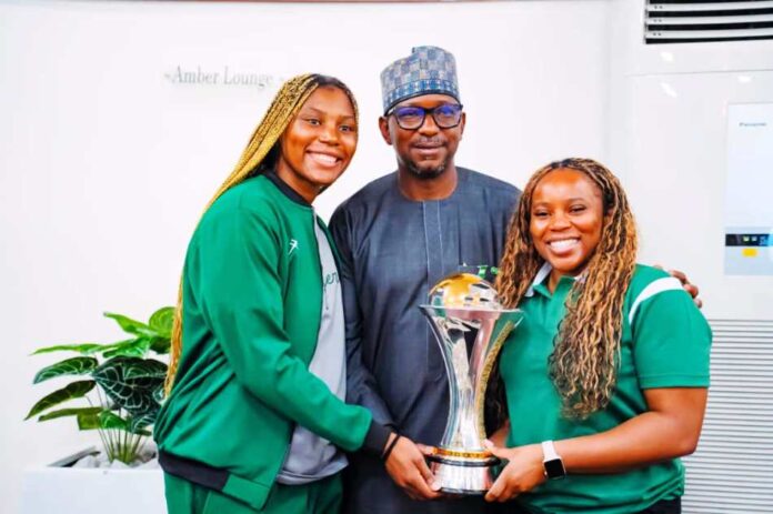 President Tinubu Showers D’Tigress With Cash Rewards3 The Chairman National Sports Commission, Mallam Shehu Dikko flanked to the right is the D Tigress Coach, Rena Wakama and to his left, the team Captain, Arny Okonkwo during the presentation of the trophy at the presidential Villa, Abuja recently.