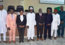 4th from L: Hon. Ismail Mohammed Agaka, Federal Commissioner Kwara State and Rep of RMAFC Chairman; 1st L: Dr. Ahmed Tijjani Ajayi, Rep of DG NSCC; 3rd L: Dr. Mories Atoke, CEO ABC Health amongst others at the Symposium in Dr. M. B. Shehu Auditorium, RMAFC HQ