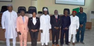 4th from L: Hon. Ismail Mohammed Agaka, Federal Commissioner Kwara State and Rep of RMAFC Chairman; 1st L: Dr. Ahmed Tijjani Ajayi, Rep of DG NSCC; 3rd L: Dr. Mories Atoke, CEO ABC Health amongst others at the Symposium in Dr. M. B. Shehu Auditorium, RMAFC HQ