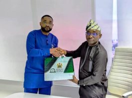 Director-General, Bureau of Public Procurement (BPP), Dr. Adebowale A. Adedokun, FCIPS, ACFE, right, exchanging pleasantries and souvenir with the CEO Equipment Leasing Registration Authority, Donald Wokoma, left, after a presentation on the Implementation of Ministry of Finance Circular on Leasing in Public Procurement