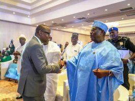 @ The First National Stakeholders' Dialogue on Power In The Health Sector held at the Abuja Continental Hotel. The Secretary to the Government of the Federation Senator George Akume CON, (representing President Bola Ahmed Tinubu GCFR) in a warm handshake with the Honourable Minister of Health & Social Welfare Dr. Iziaq Adekunle Salako