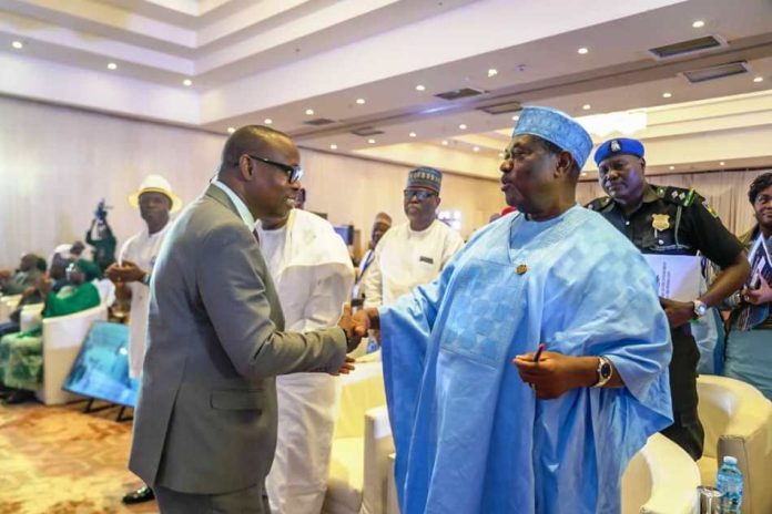 @ The First National Stakeholders' Dialogue on Power In The Health Sector held at the Abuja Continental Hotel. The Secretary to the Government of the Federation Senator George Akume CON, (representing President Bola Ahmed Tinubu GCFR) in a warm handshake with the Honourable Minister of Health & Social Welfare Dr. Iziaq Adekunle Salako