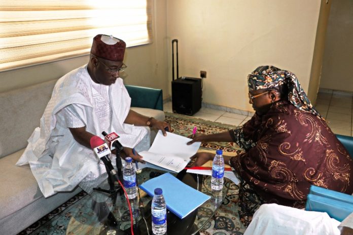 Executive Director, Dr. Aminu Zaria The Executive Director, NIWRMC, Dr. Abdulmumini Muhammed Aminu Zaria receiving the handing over note from the Acting Executive Director, Mrs Sakinatu Suleiman Abbo Jimeta at the Commission