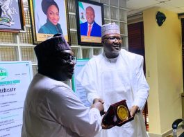 Director-General MCO, Engr. Obadiah Simon Nkom receiving a plaque award presented by the Registrar-General of the Corporate Affairs Commission (CAC), Hussaini Ishaq Magaji, SAN during a courtesy visit by MCO officials to CAC on Tuesday 2nd September 2025, held at CAC headquarter, Abuja.
