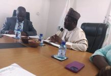 Dr Mukhtar Yawale Muhammad, Permanent Secretary FMACT&CE (right) with Mr Esewhaye Richard Ovie, the over seeing DG, NTDA