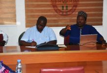 World Bank Project Coordinator, Mr Siakpere and his team briefing a Cross section of SERVICOM Management team