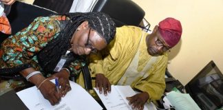L-R : Deputy Director of Hydropower, Research and Development Energy Commission of Nigeria (NACHRED) Dr. Toyin Olugbemi and The Director of Geodesy at OSGOF, Surv. Duniya Magaji during the signing of Hydropower Development Natiowide MOU today