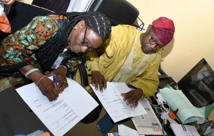 UNIDO Meeting2 L-R : Deputy Director of Hydropower, Research and Development Energy Commission of Nigeria (NACHRED) Dr. Toyin Olugbemi and The Director of Geodesy at OSGOF, Surv. Duniya Magaji during the signing of Hydropower Development Natiowide MOU today