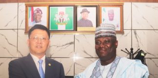 L-R: Deputy General Manager Comac Marketing and Sales Center, Yang Yang presenting a Souvenir to the Permanent Secretary Federal Ministry of Aviation and Aerospace Development; Dr. Ibrahim Abubakar Kana, mni during a courtesy call by COMAC