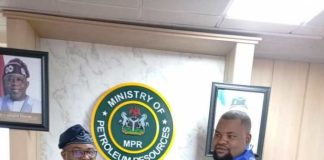 The representative of the Hon. Minister of State Petroleum Resources (Gas), Engr. Abel NSA (l), receiving a plaque from the Chairman of the Society for Human Development and Integration in Nigeria (SOHDIN) Mr. Lordswill Umani (r) during their courtesy visit to the Minister in Abuja.