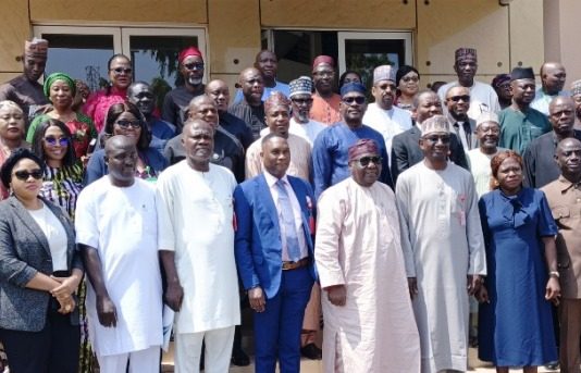 Representative of the Director-General, Bureau of Public Procurement (BPP) and Director, Civil Infrastructure Department (CID), BPP, Engr. Nasir M. Bello 5th right, Director-General, Bureau of Public Service Reforms (BPRS), Dr. Dasuki Ibrahim Arabi 7th left, Engr. Isaiah Yesufu 6th left, Director, Compliance, Certification and Monitoring Department (CCM), some management staff of the Bureau and Participants in a group photograph during Bureau's Three-Day Refresher Training/Workshop for Procurement Officers of SGL 14-16 in the Pool of the BPP in Abuja