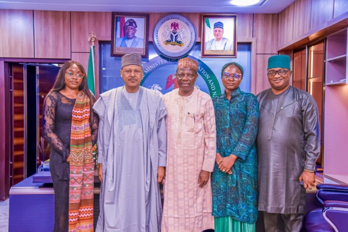_DSC2165 Honourable Minister of Information and National Orientation, Mohammed Idris (2nd left), in a group photograph with representatives of the Abdullahi Omaki Community Peace Initiatives Network during a courtesy visit to the Ministry in Abuja on October 8, 2025. With him are Amb. Abdullahi A. Omaki, EVC/Founder, Abdullahi Omaki Community Peace Initiatives Network (3rd left); Sir Bola Abimbola, Member, Board of Trustees (1st right); Mrs. Panritmwa Haryy-Odoh, Programme Officer (2nd right); and Patience Ikoro, Executive Assistant (1st left).