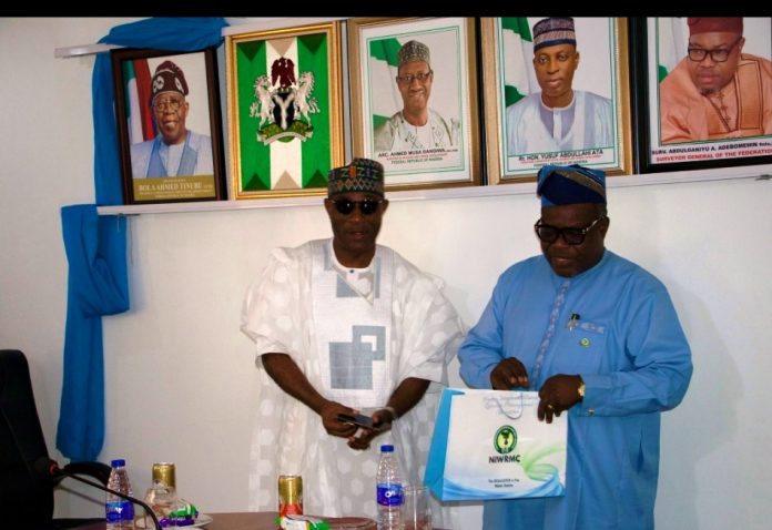 Data Sharing The Executive Director, NIWRMC, Dr. Abdulmumini Aminu Zaria (L) with the Surveyor General of the Federation, Surveyor Abdulganiyu Adebomehin (R) at OSGOF in Abuja