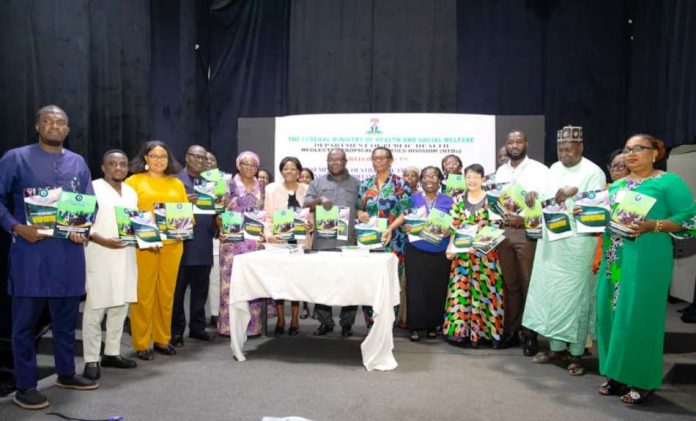 Middle: Dr. Nse Akpan Director Port Health Division representing the Permanent Secretary; To his Right: Dr. Margaret Mafe, Chairman NTD-WASH Subcommittee; To his Left: Mrs. Chinwe Okoye, Programme Manager, National Lymphatic Filariasis Elimination Programme FMoHSW Supported by Representatives from the World Health Organisation WHO and, other Development Partners.