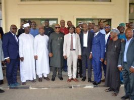 Middle RMAFC Chairman, Dr. Mohammed Bello Shehu OFR, Coordinating Director FIRS Mr. Shettima Tamadi, Secretary to the Commission, Nwaze Joseph Okechukwu, other officials from RMAFC, FIRS and the engaged consultants in a