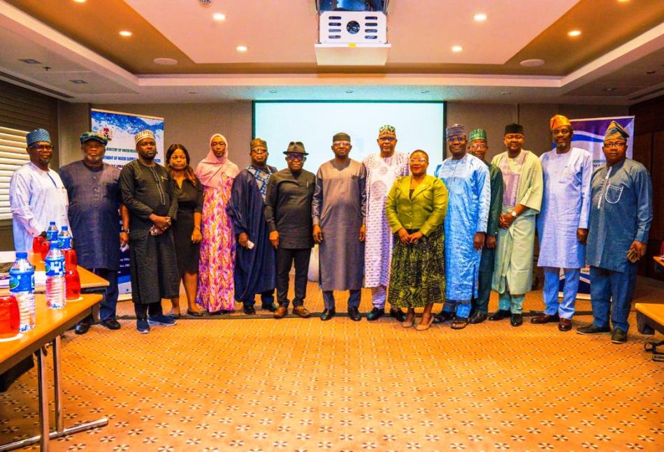 Group photograph of the Honourable Minister, state commissioners, and World Bank representatives during the Review Meeting.