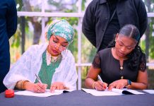 The Minister of Art, Culture, Tourism and Creative Economy, Hannatu Musa Musawa, and Julia Azubuike, Program Director of Lens for Good Initiative, sign Strategic MoU with Lens for Good Initiative to empower Nigerian creatives through innovation, storytelling, and skill development. October 20th, 2025, Abuja, Nigeria.