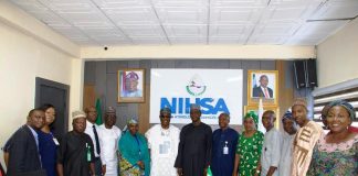 The Executive Director, NIWRMC, Dr Abdulmumini Aminu Zaria (7th L) and the Director General of NIHSA, Umar Ibrahim Muhammed (7th R) with staff of both Agencies in Abuja