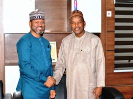 Minister’s Aide Congratulates PR Director on Service Delivery Award