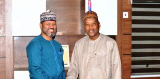 Minister’s Aide Congratulates PR Director on Service Delivery Award