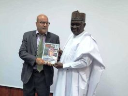 NTAC DG, RT. HON. YUSUF BUBA YAKUB PRESENTING A SOUVENIR TO THE REPRESENTATIVE OF THE TUNISIAN MINISTER OF CULTURE.