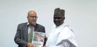 NTAC DG, RT. HON. YUSUF BUBA YAKUB PRESENTING A SOUVENIR TO THE REPRESENTATIVE OF THE TUNISIAN MINISTER OF CULTURE.