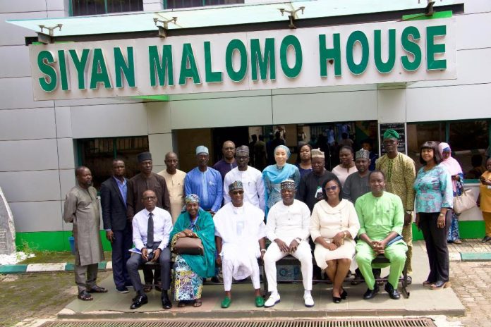 Partnership on Regulatory Functions The Executive Director, NIWRMC, Dr. Abdulmumini Aminu Zaria (3rd L) and The Director General, NGSA, Professor Olusegun Omoniyi Ige (3rd R) with staff of both organisations in a group picture in Abuja