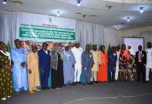 Solid Minerals Committee Members, RMAFC Members and Staff in a group photograph at the Sensitisation Exercise