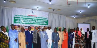 Solid Minerals Committee Members, RMAFC Members and Staff in a group photograph at the Sensitisation Exercise