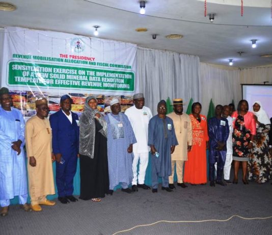 Solid Minerals Committee Members, RMAFC Members and Staff in a group photograph at the Sensitisation Exercise