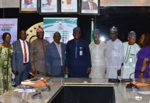 Permanent Secretary, Dr Shuaib Belgore in a group picture with Inaugurated Members of the Departmental Award Selection Committee of the Federal Ministry of Housing and Urban Development.