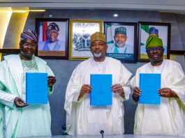 L-R, the Director General, NASRDA, Dr Mathew Adepoju, Minister of Agriculture and Food Security, Sen Abubakar Kyari and Permanent Secretary, Dr Marcus Ogunbiyi during the Signing of Memorandum of Understanding.