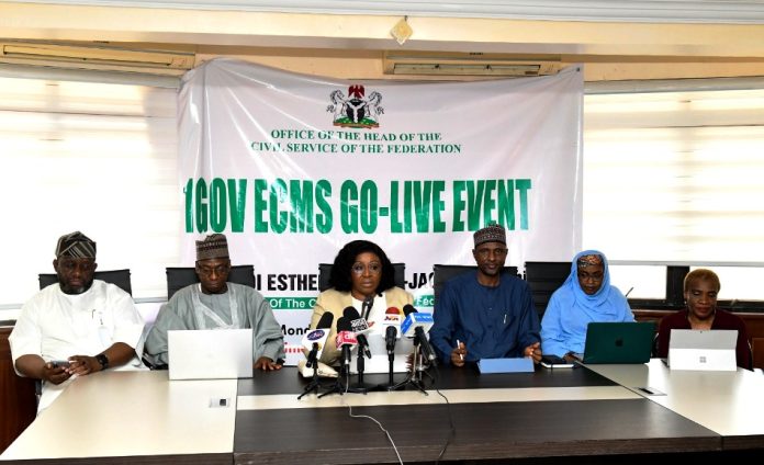 HCSF, Mrs. Didi Esther Walson-Jack, OON, mni, (m) delivering the keynote address at the Go-Live event of the OHCSF IGov cloud ECMS. She is flanked by some Permanent Secretaries, Amb Dunoma Umar Ahmed, Foreign Affairs (2nd L), Engr Faruk Yusuf Yabo , Solid Minerals Development, (3rd R), Mrs Fatima Mahmood, Career Management Office (2nd Right), and Arc Joy Baderin, Director, Overseeing Office of Permanent Secretary, Special Duties Office (SDO) (Ist Right) and Representative of the MD/CEO of Galaxy Backbone, Mr Sani Ibrahim (1st L).