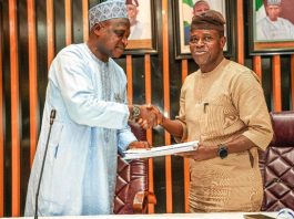 The Incoming Permanent Secretary , Mr. Rafiu Olarinre Adeladan (Right) taking over the Handover document from Engr. Olufunsho O. Adebiyi, represented by the Director, Human Resource Management, Mr Aliyu Abdulahil at the Ministry’s Headquarters, Mabushi, Abuja.