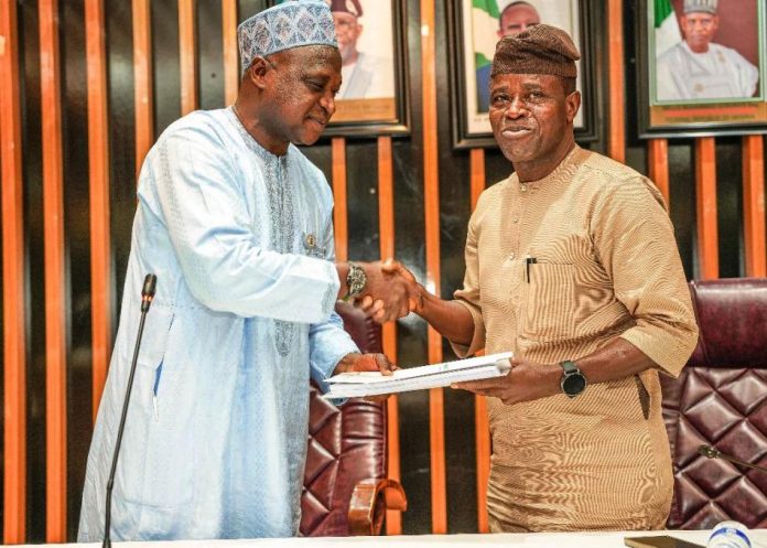 The Incoming Permanent Secretary , Mr. Rafiu Olarinre Adeladan (Right) taking over the Handover document from Engr. Olufunsho O. Adebiyi, represented by the Director, Human Resource Management, Mr Aliyu Abdulahil at the Ministry’s Headquarters, Mabushi, Abuja.