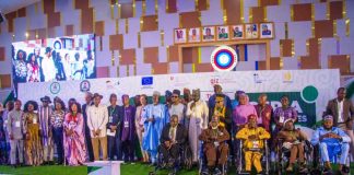 Executive Secretary National Commission for Persons with Disabilities (NCPWD) making his speech and a group photograph of the Heads of Disability Commissions and Agencies with minister of State for Humanitarian Affairs and Poverty Reduction, Yusuf Tanko Sanunu, who represented the president during the National Disability Summit in Abuja.