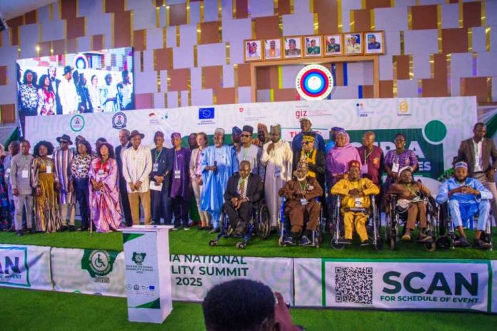 National Disability Summit  Executive Secretary National Commission for Persons with Disabilities (NCPWD) making his speech and a group photograph of the Heads of Disability Commissions and Agencies with minister of State for Humanitarian Affairs and Poverty Reduction, Yusuf Tanko Sanunu, who represented the president during the National Disability Summit in Abuja.