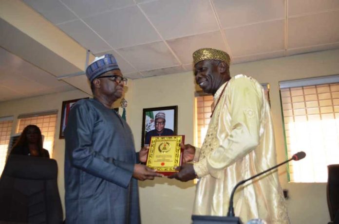 RMAFC Chairman RMAFC Chairman, Dr. Mohammed Bello Shehu OFR presenting a memorabilia to Chairman HOSCON, Prince Michael Emuh