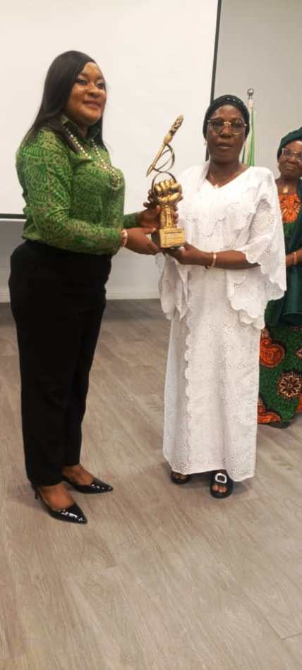 Rep. of the NOA DG and his Media Aide, Tolu Meduna, as she presents an Award to the Majority Leader of the Adamawa State House of Assembly at the event.