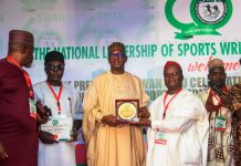 An award is being presented to the Chairman National Sports Commission, Mallam Shehu Dikko, by Chief Donatus Agu Ejioke, for his outstanding supports for the Sports writer Associations of Nigeria, during their 60 years anniversary celebrations at the MKO Abiola Stadium,  Abuja
