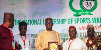An award is being presented to the Chairman National Sports Commission, Mallam Shehu Dikko, by Chief Donatus Agu Ejioke, for his outstanding supports for the Sports writer Associations of Nigeria, during their 60 years anniversary celebrations at the MKO Abiola Stadium,  Abuja