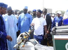 From left: National President, National Commercial Tricycle and motorcycle owners and riders Association (NATOMORAS), Alhaji Usman Gwoza; Representative of President, Muhammadu Dingyadi; Minister of Youth Development, Comrade Ayodele Olawande and the Chief Executive Officer, House of Destiny, Dr Israel Olajumoke, during the National launch of the electric tricycle empowerment initiative organised by the Federal Ministry of Youth Development in collaboration with House of Destiny and NATOMORAS in Abuja on Wednesday (26/11/25).