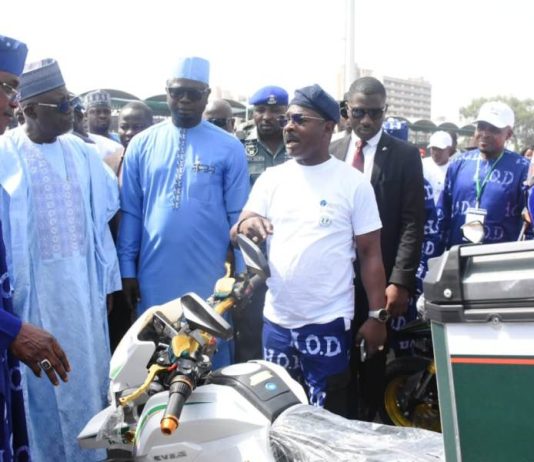 From left: National President, National Commercial Tricycle and motorcycle owners and riders Association (NATOMORAS), Alhaji Usman Gwoza; Representative of President, Muhammadu Dingyadi; Minister of Youth Development, Comrade Ayodele Olawande and the Chief Executive Officer, House of Destiny, Dr Israel Olajumoke, during the National launch of the electric tricycle empowerment initiative organised by the Federal Ministry of Youth Development in collaboration with House of Destiny and NATOMORAS in Abuja on Wednesday (26/11/25).