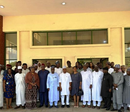 From 6th L (front row): RMAFC Chairman, Dr. Mohammed Bello Shehu OFR; The Executive Governor of Kogi State, Alh. Ahmed Usman Ododo FCA; Representative of NUPRC, Mrs Jenifer Ekekhide, Fed Commissioner representing kogi state, Hon Abdulaziz king and others in a group photograph at RMAFC HQ, Abuja.