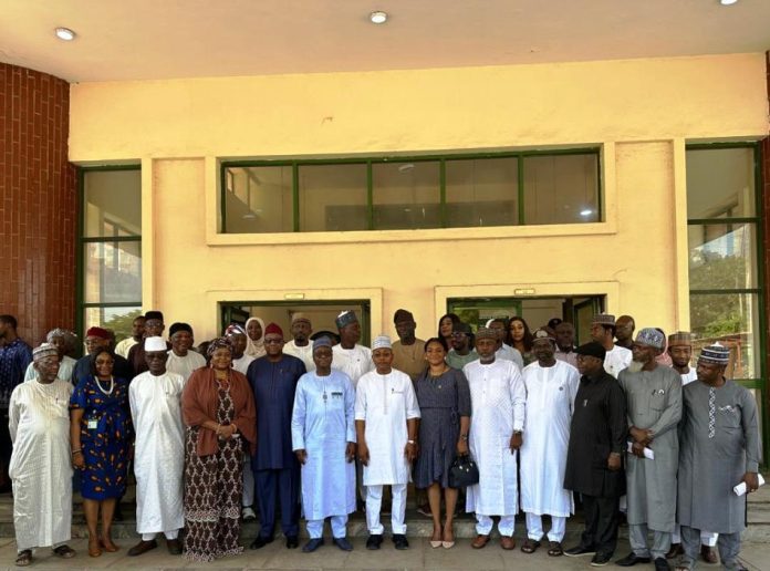 From 6th L (front row): RMAFC Chairman, Dr. Mohammed Bello Shehu OFR; The Executive Governor of Kogi State, Alh. Ahmed Usman Ododo FCA; Representative of NUPRC, Mrs Jenifer Ekekhide, Fed Commissioner representing kogi state, Hon Abdulaziz king and others in a group photograph at RMAFC HQ, Abuja.