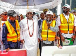 His Excellency, President Asiwaju Ahmed Tinubu, GCFR, represented by the Minister of Works, Sen. Engr. David Umahi, CON (2nd right), opening the road together with the Representative of the Governor and Commissioner of Transportation, Hon. Oluwaseun Osinyemi (1st right), the Chairman, Senate Committee on Works, Sen. Barinada Mpigi (1st left), and His Royal Majesty, Oba Abdul-Wasiu Omogbolahan Lawal (2nd right) the Oniru of Iru Land.